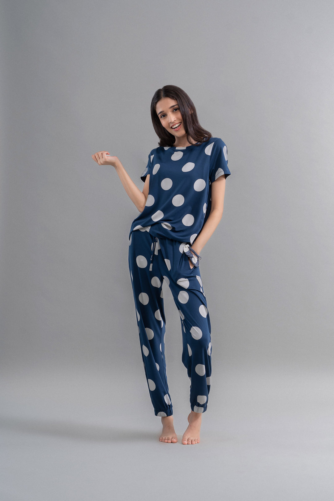 Sleepy Navy Polka Supima Cuffed Bottoms model wearing comfortable loungewear.