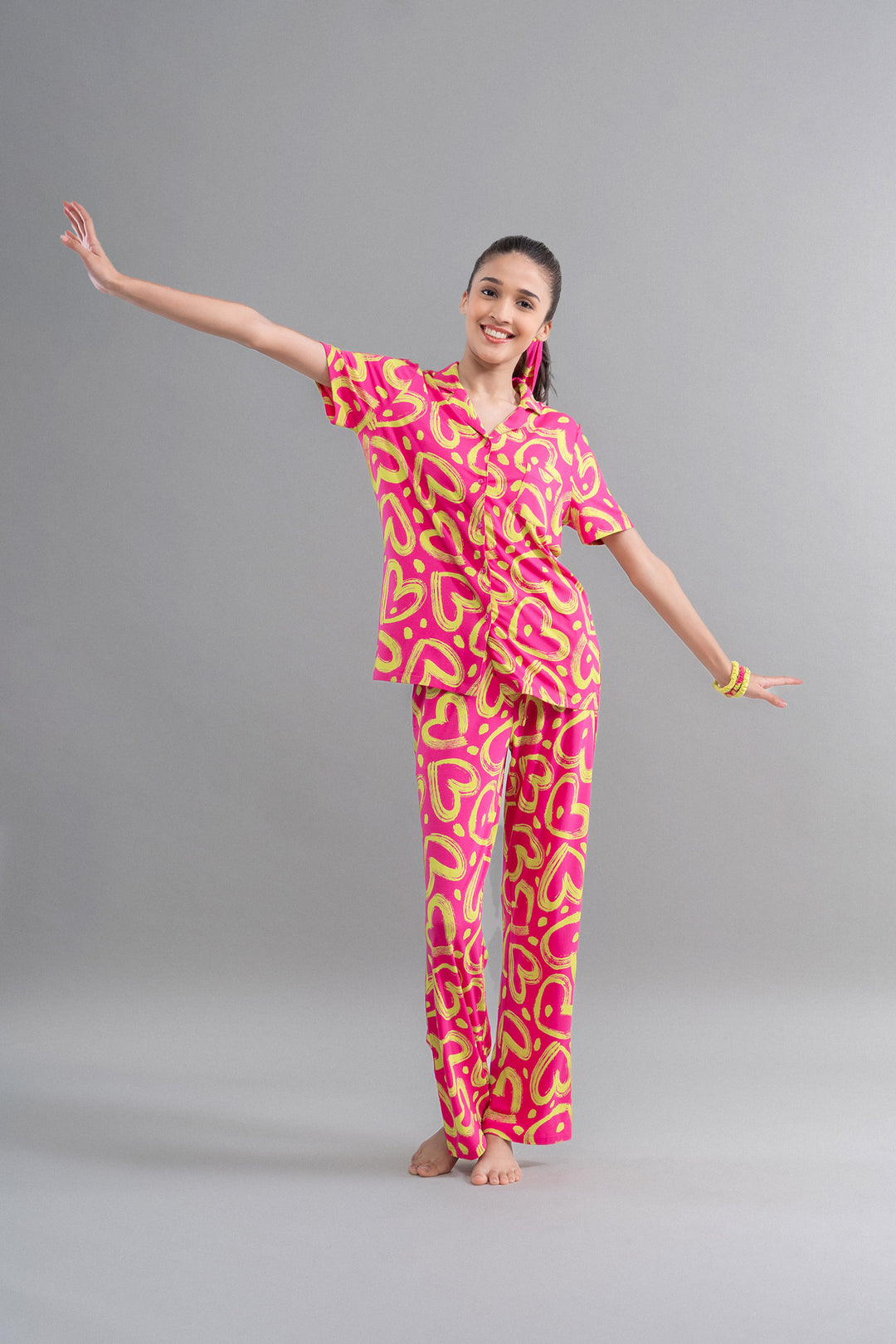 Limited Edition Lovestruck Pink Heart Pajama Set worn by a model.