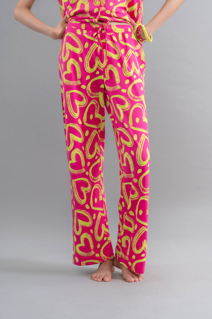 Limited Edition Lovestruck Pink Heart Flared Pajamas featuring vibrant heart patterns.