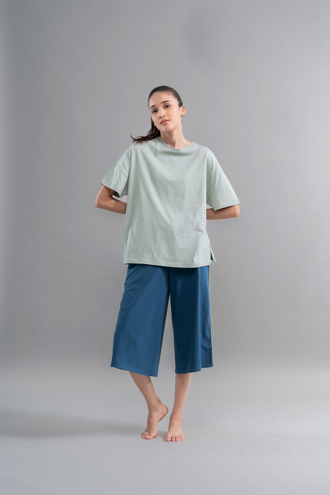 Sage teal cotton culotte set styled on a model.