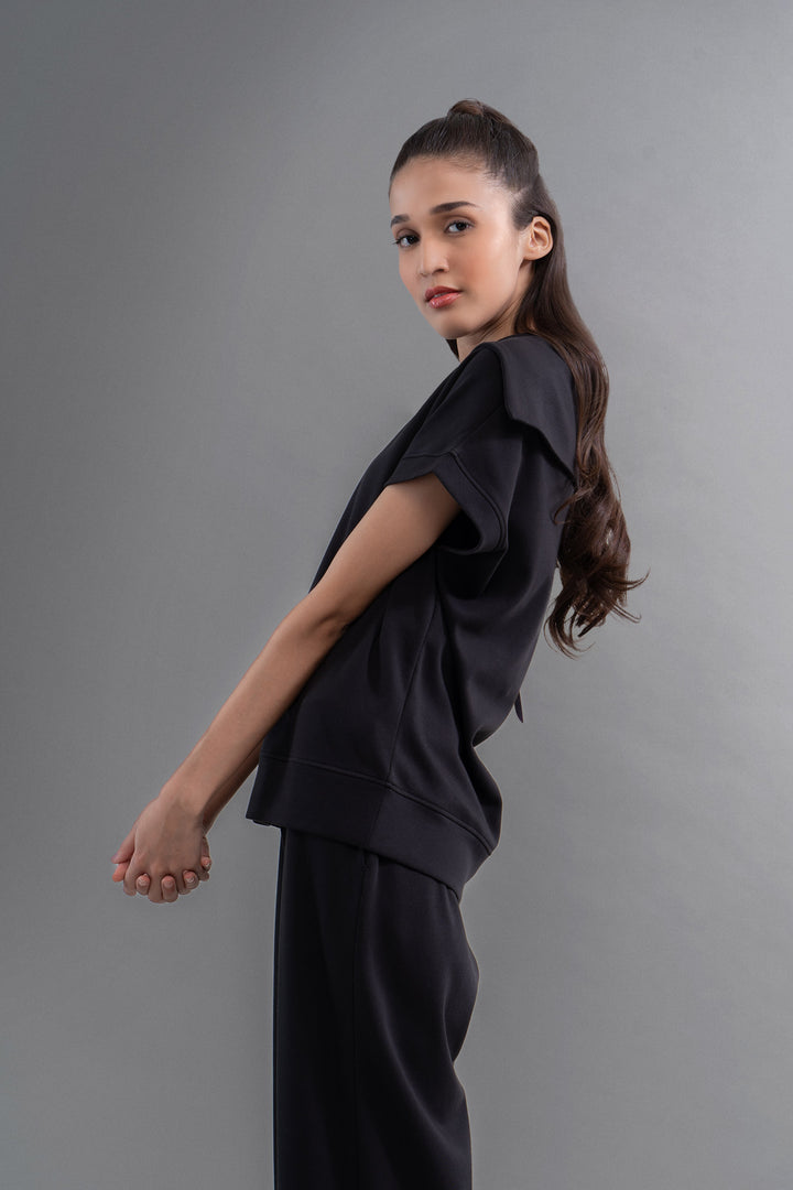 Model wearing Snugknit® Co Ord Set in black with stylish design.