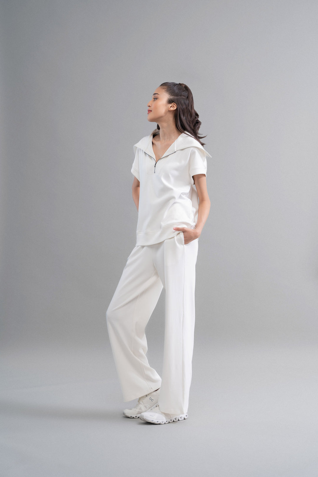 Model wearing Snugknit® Co Ord Set in white on gray background.