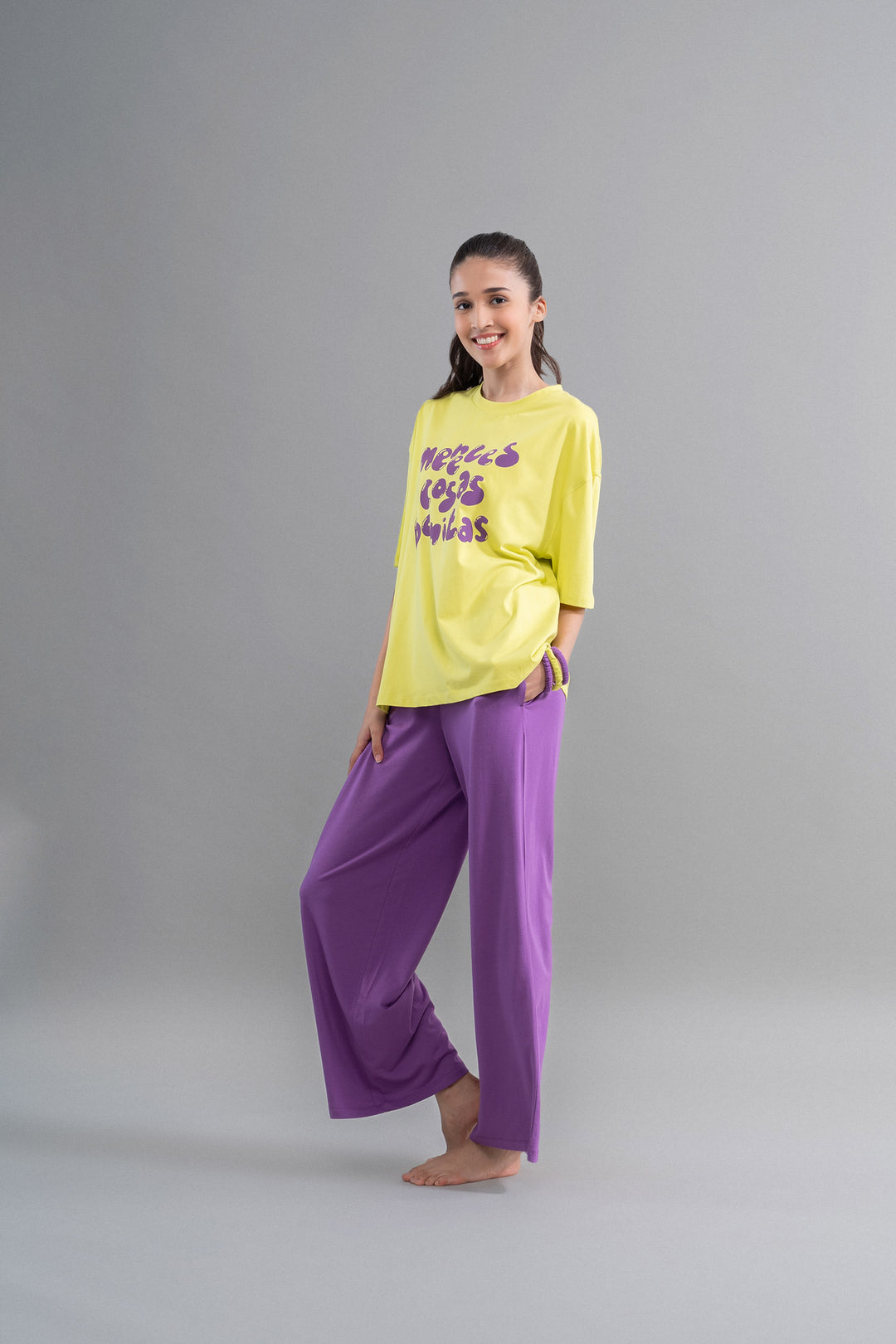 Lime purple cotton lounge set displayed by a smiling model.