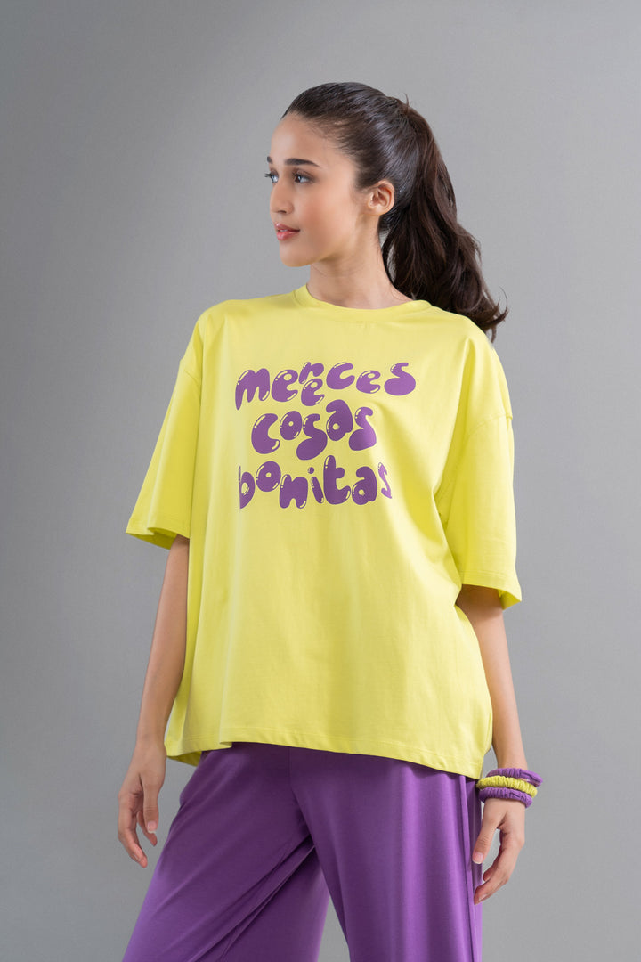 Yellow oversized top with playful purple text design.