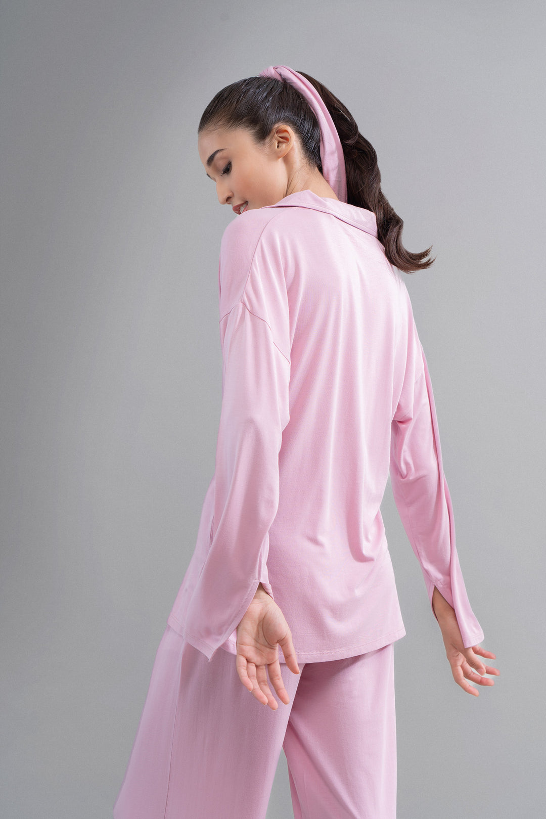 Deep pink modal button-down shirt with slit, stylish women's apparel.