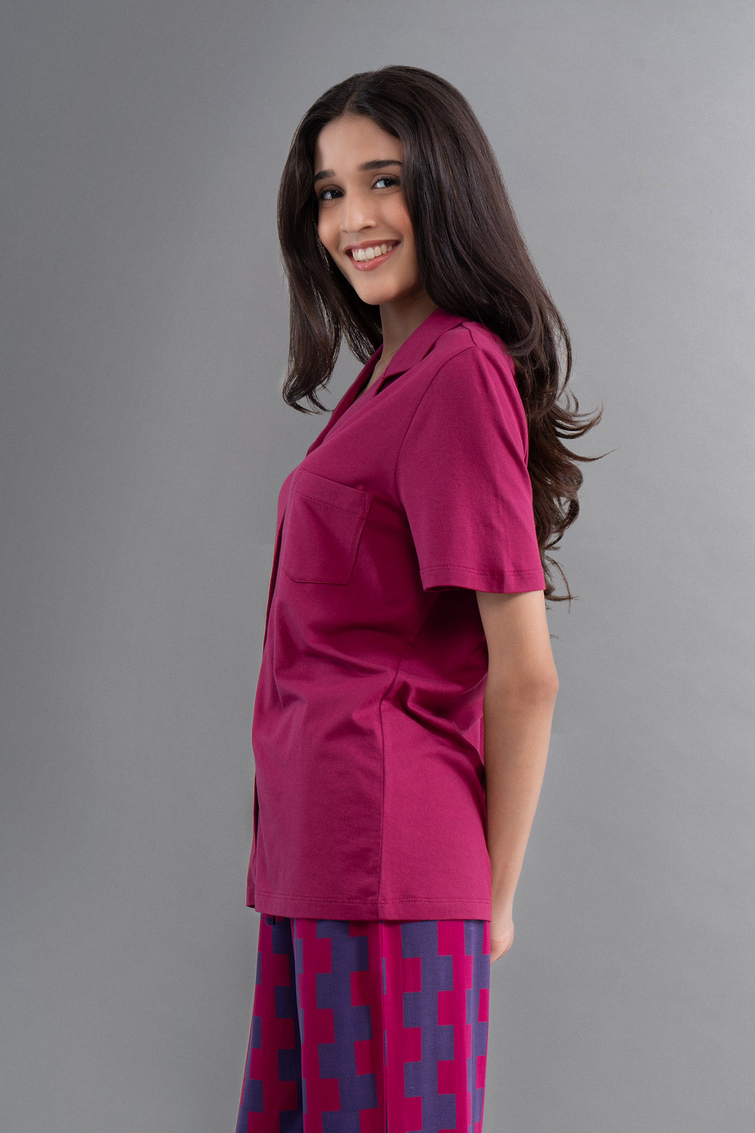 Ruby Supima half sleeve button-down shirt styled with fashionable pants.