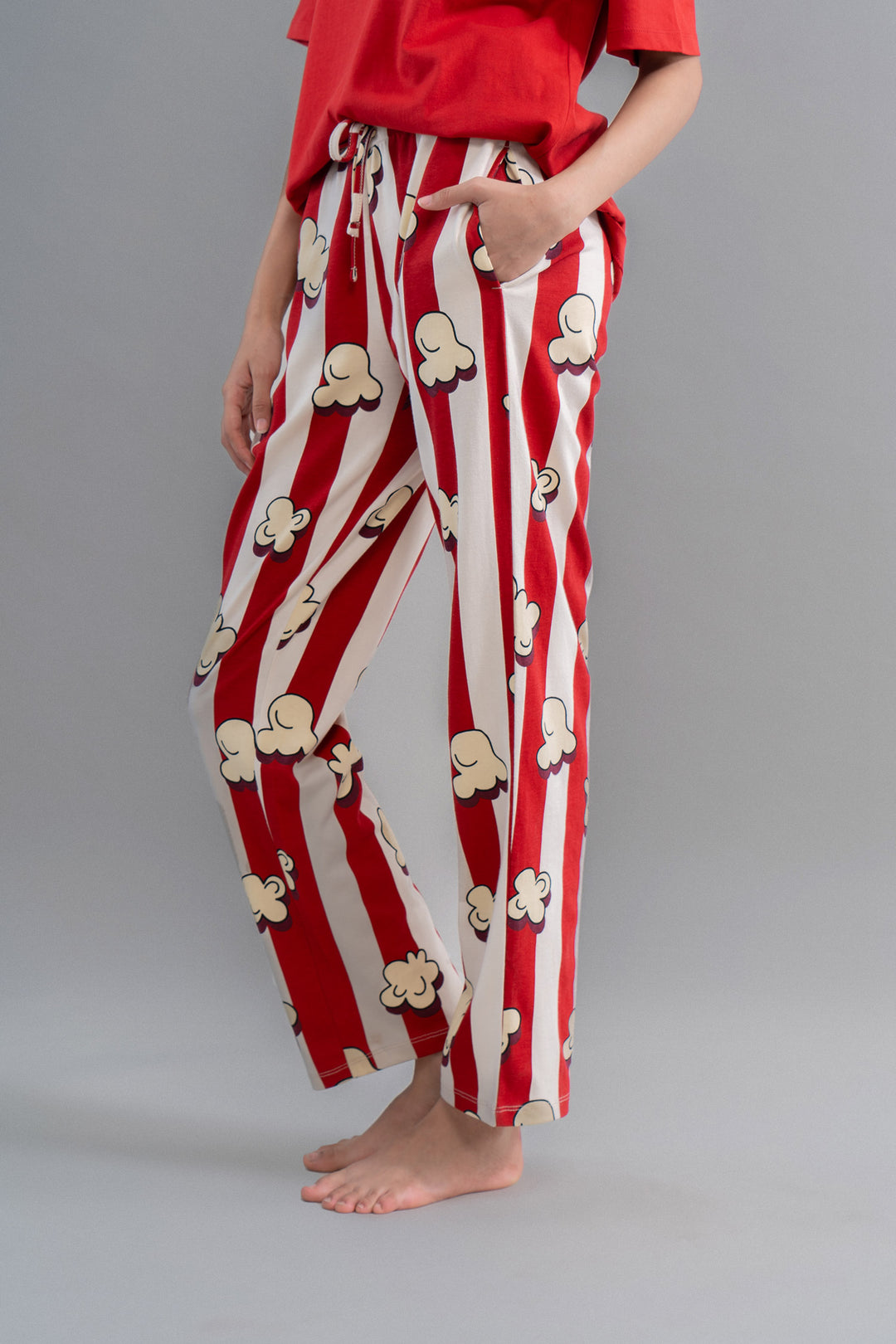 Red striped pajamas with popcorn pattern for cozy movie nights.