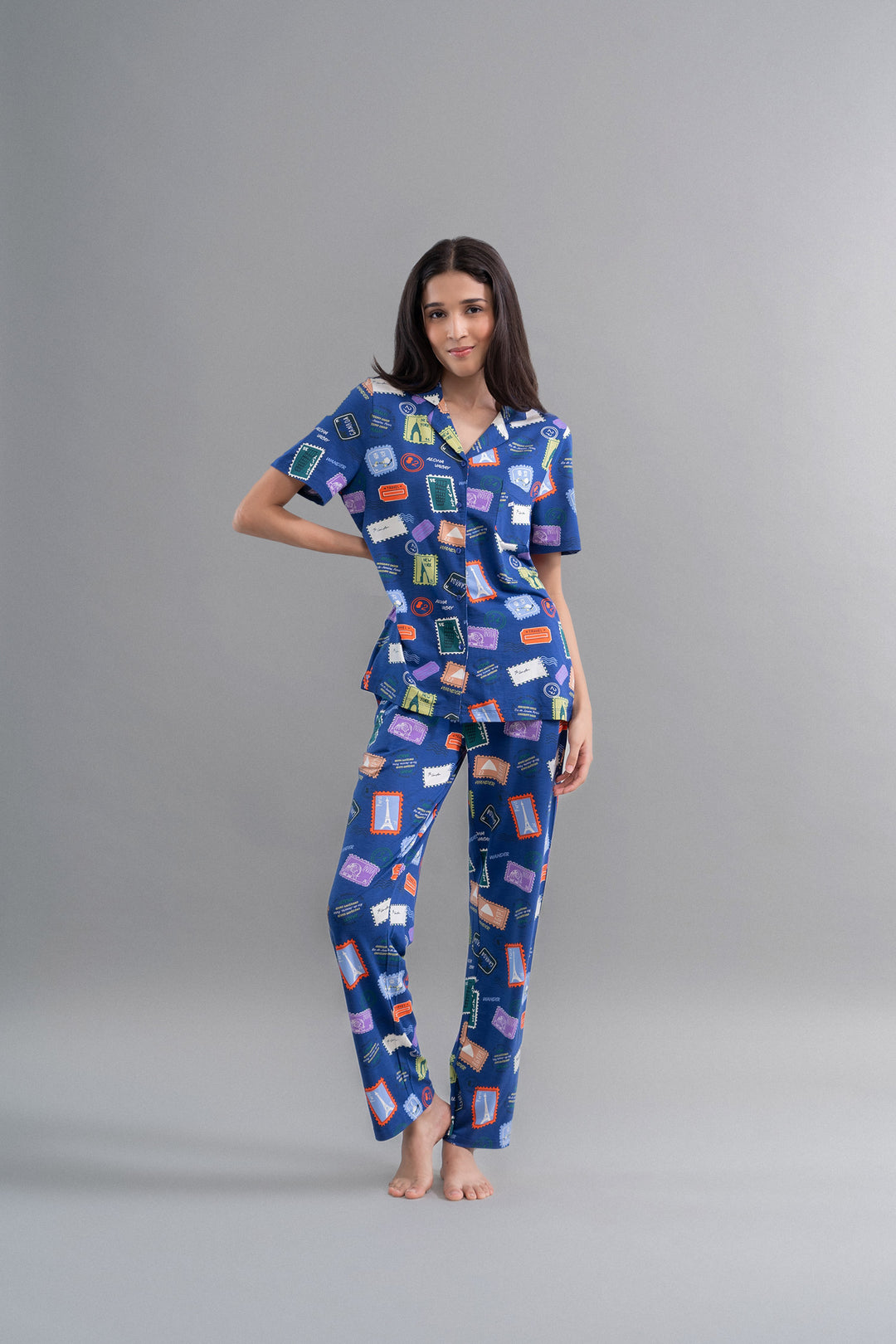 Wanderlust Blue Modal Button Down Pajama Set with colorful print model.