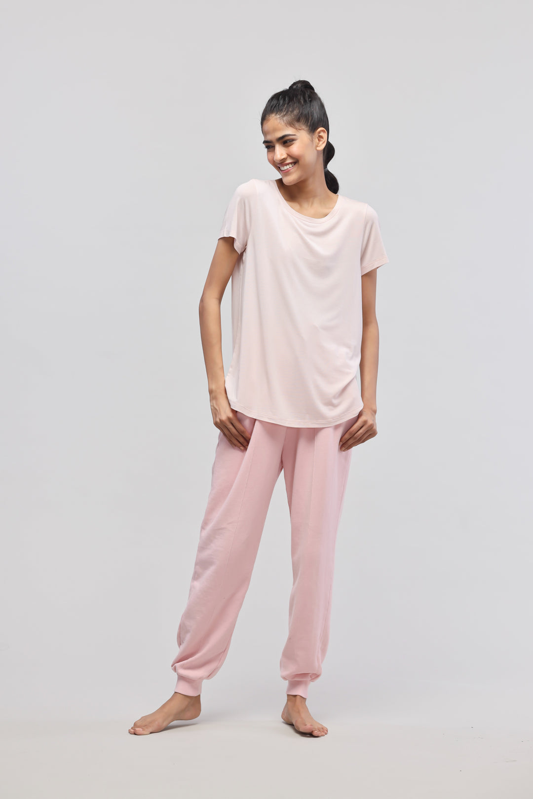 Elegant pink terry set featuring a light pink regular top and comfortable pants.