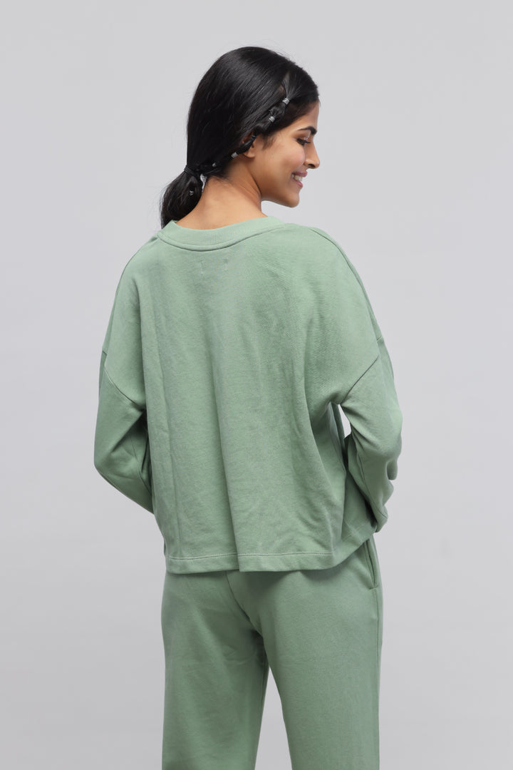 Mint green puffed sleeves terry sweatshirt for a stylish look.