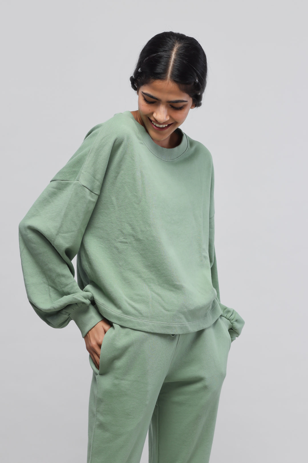 Mint green puffed sleeves terry sweatshirt styled casually.