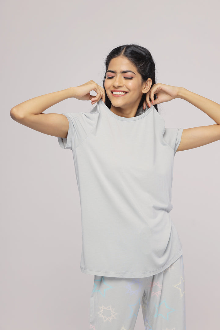 Smiling model wearing the Zen Grey Top, showcasing casual style.