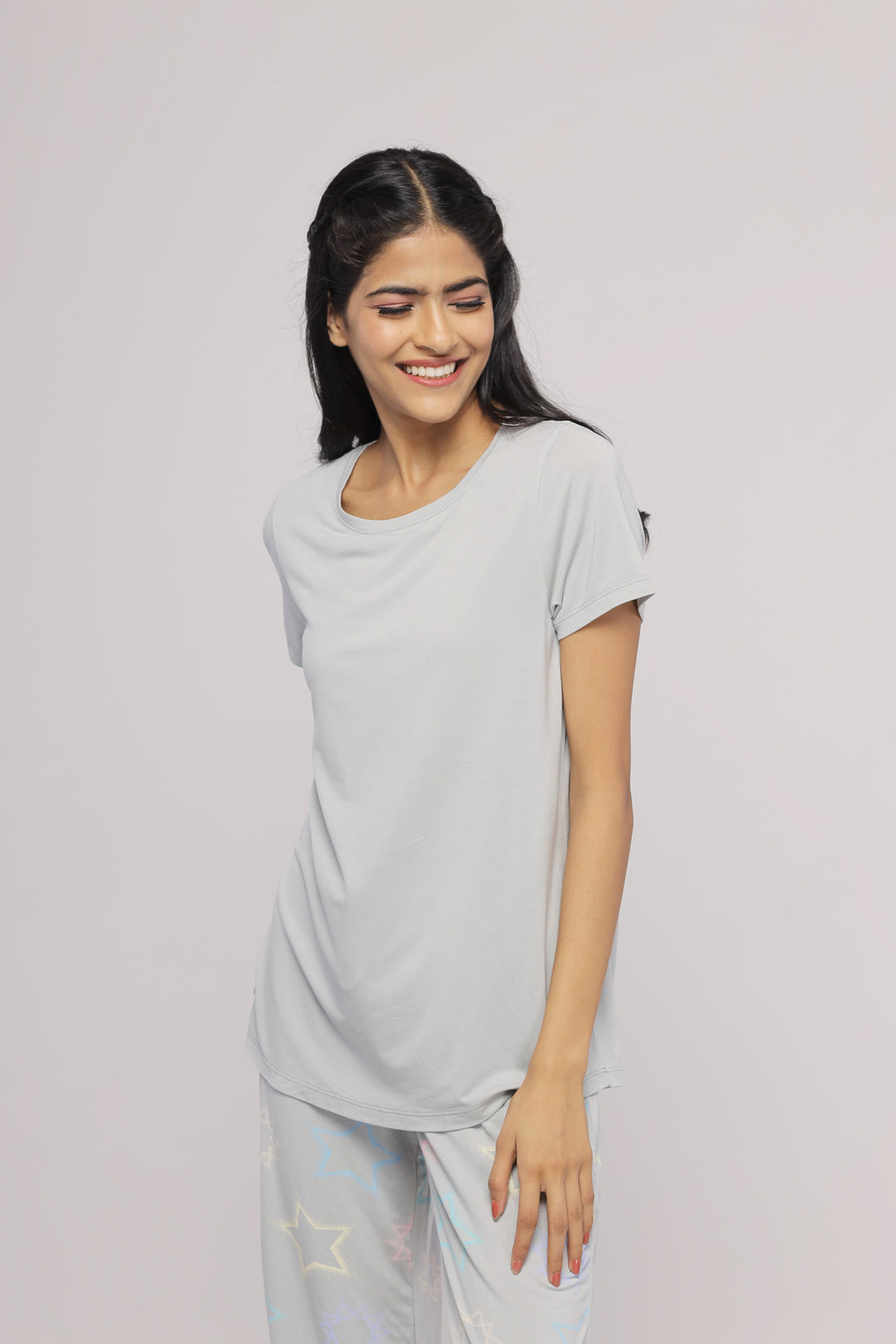 Woman smiling while wearing a Zen Grey Top casual shirt.