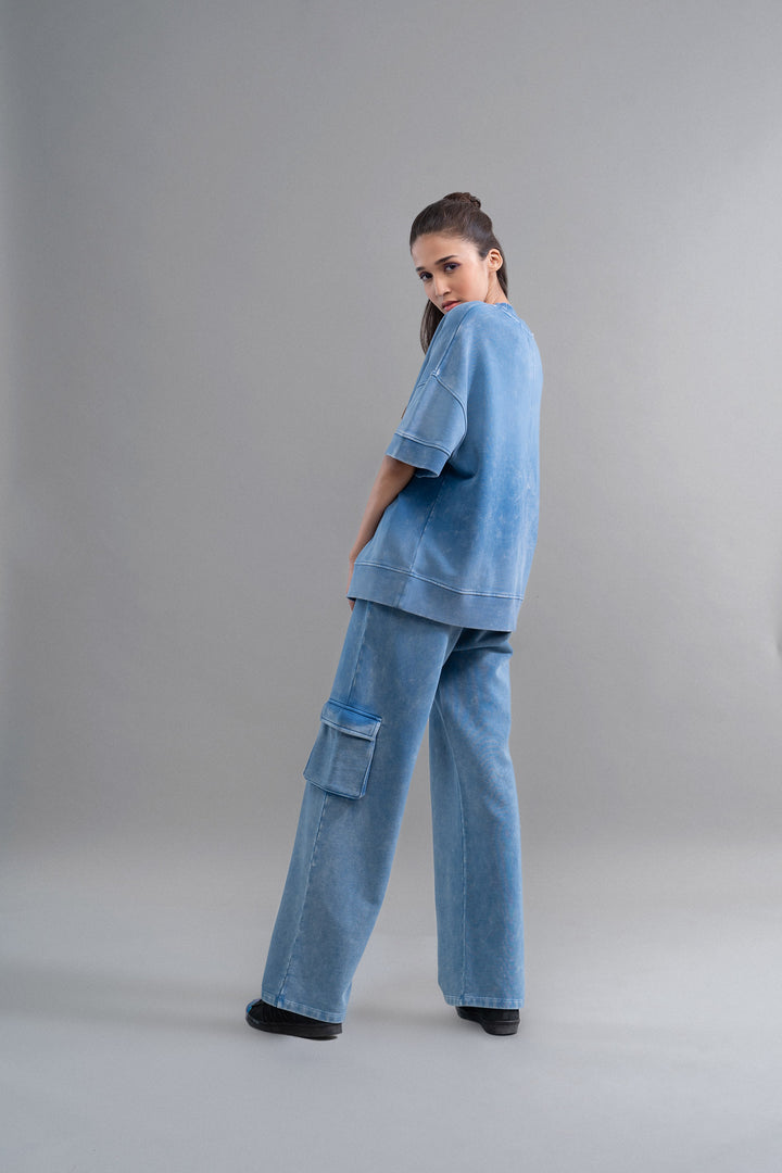 Denim Wash 100% Cotton Terry Cargo Pant model in blue outfit.