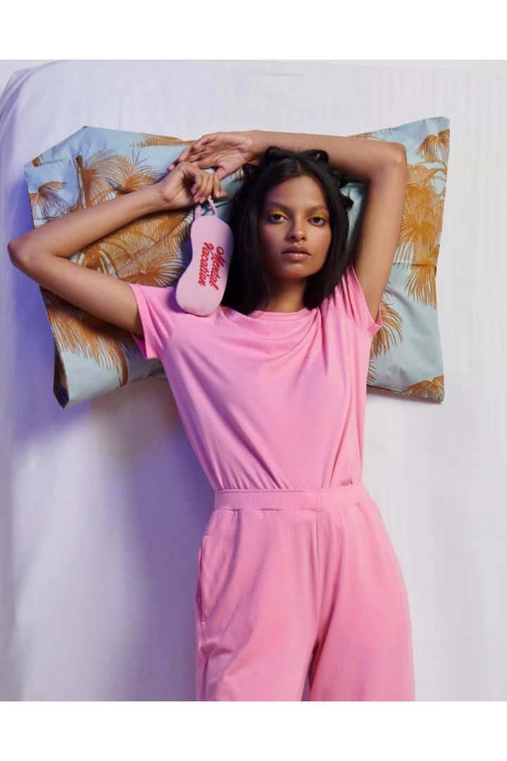 Model showcasing a stylish Pink Supima® Co-ord Set with sleep mask.