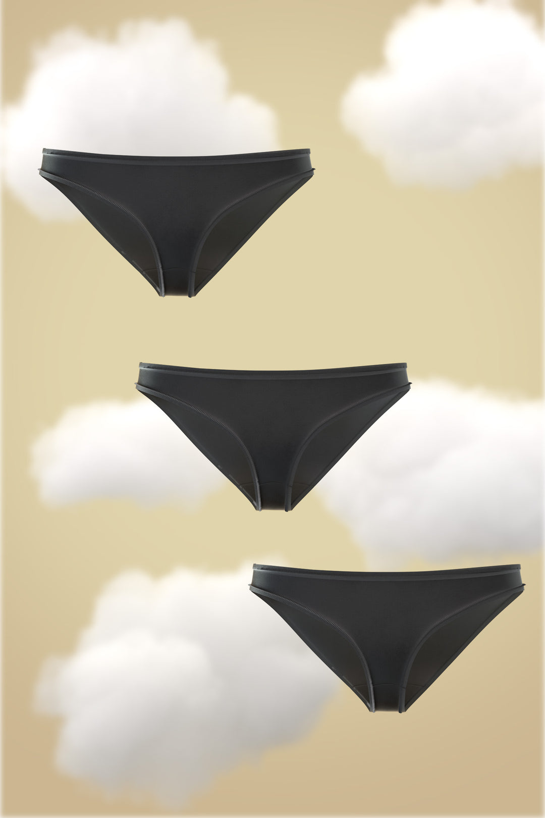 Set of three Midnight Black Modal bikinis against a soft cloud background.