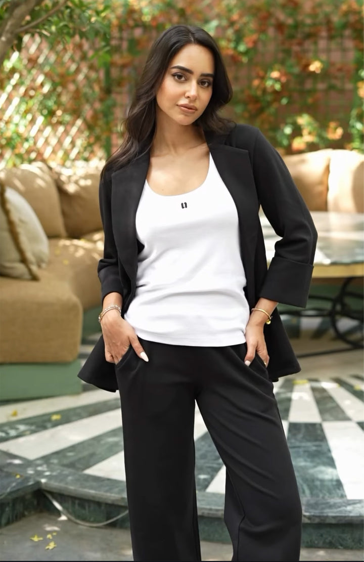 Snugknit black blazer set styled with a white tank top.