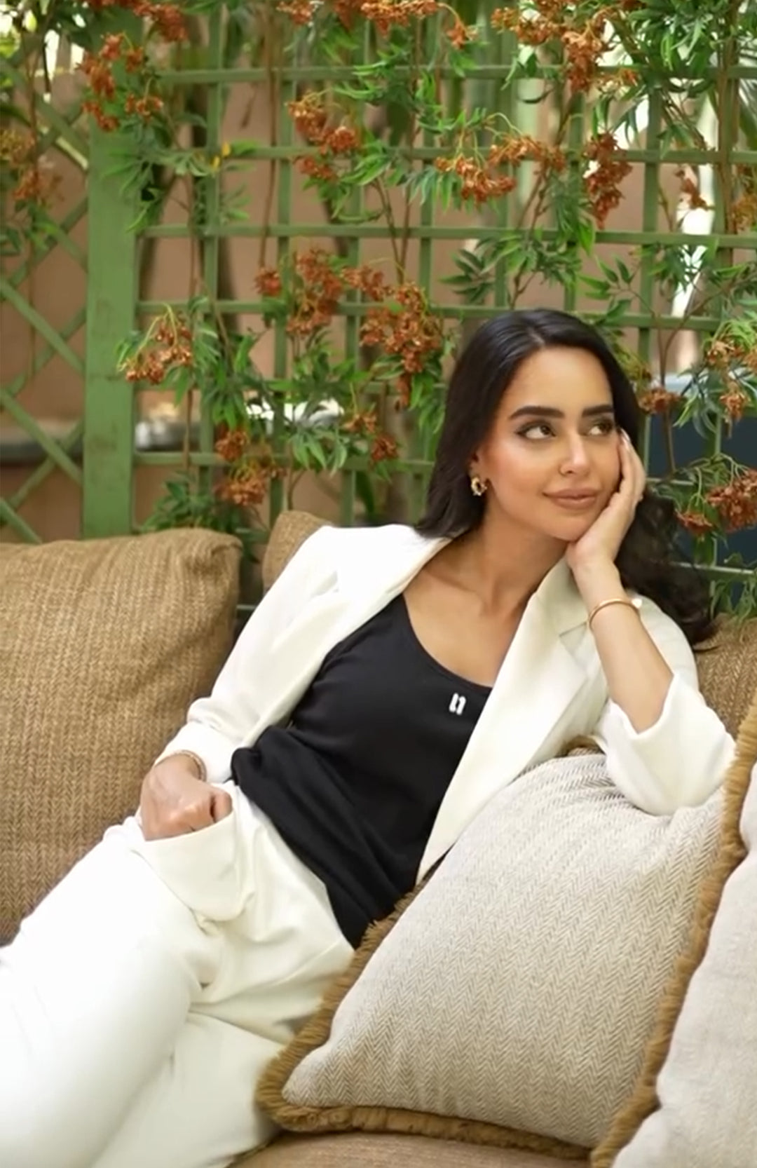 Stylish woman wearing Snugknit Ivory Blazer Set, posing elegantly.