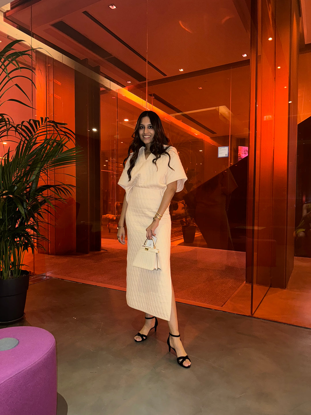 Model showcasing a chic quilted white skirt set in stylish setting.