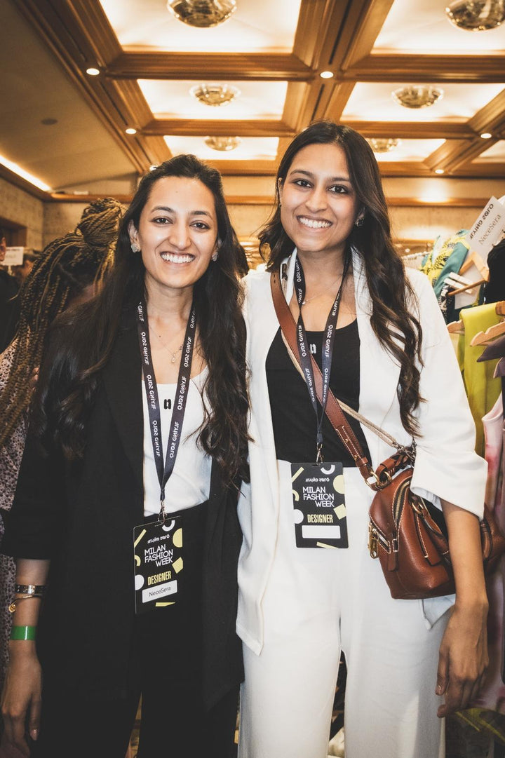 Stylish women wearing Snugknit Black Blazer Set at a fashion event.