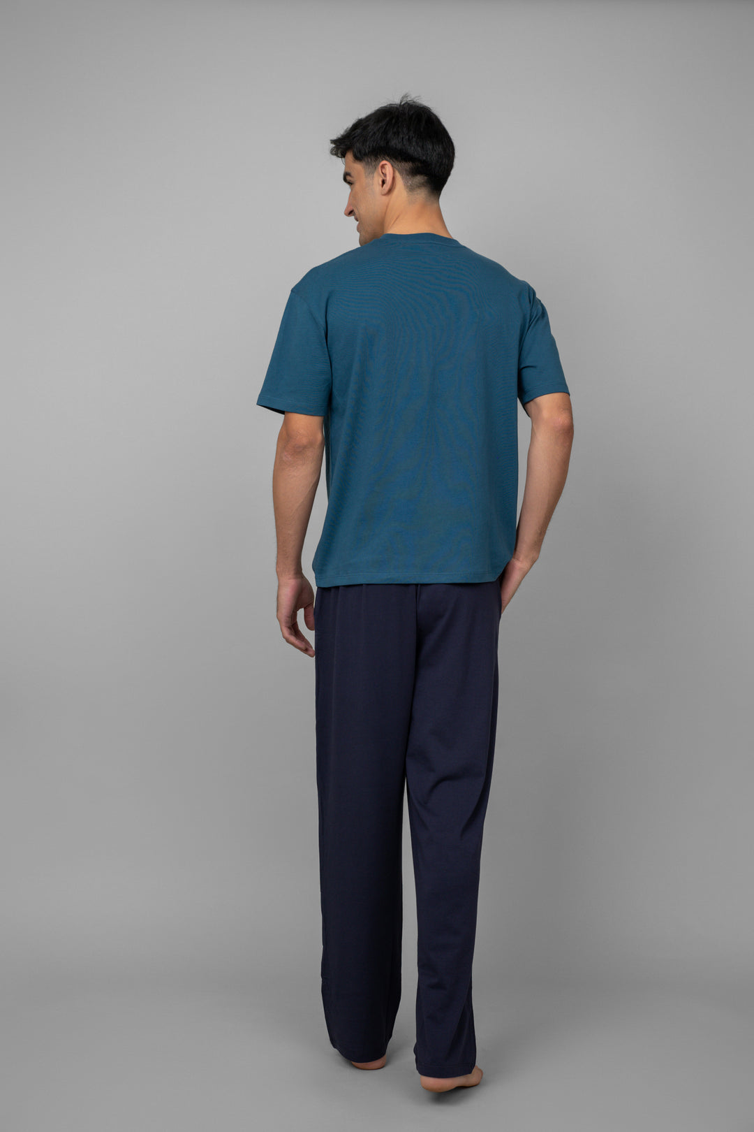 Dark navy men's pajama set with short sleeves and long pants.