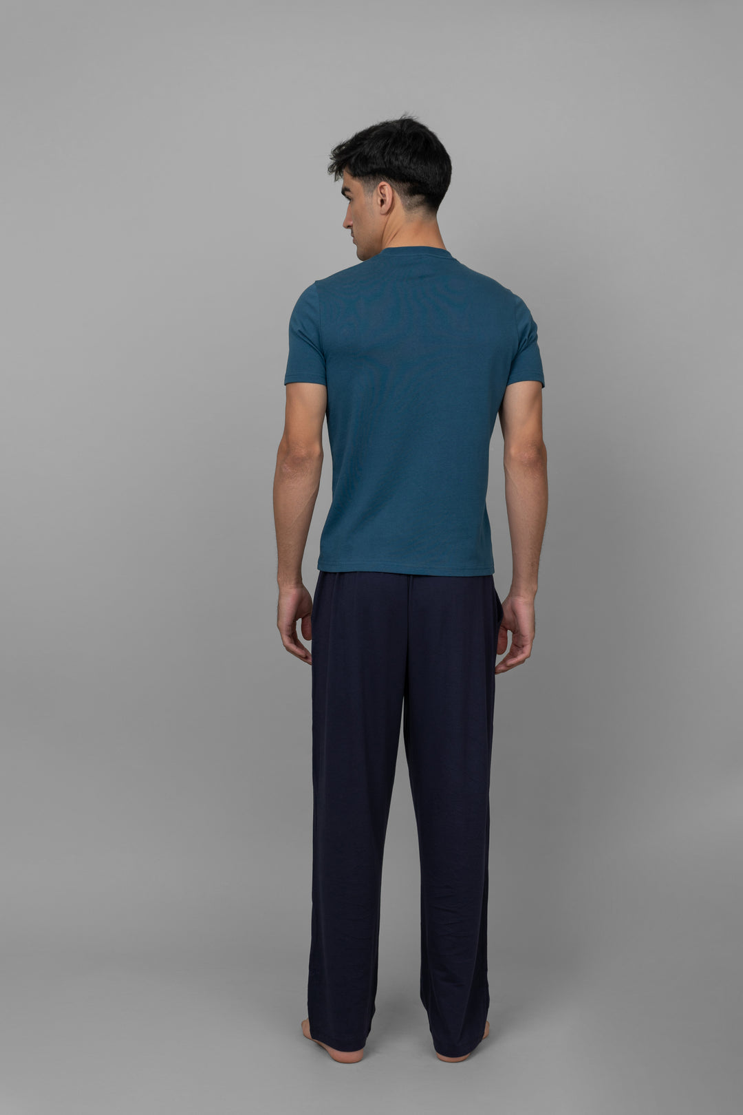 Teal men's lounger set with comfortable t-shirt and pants.