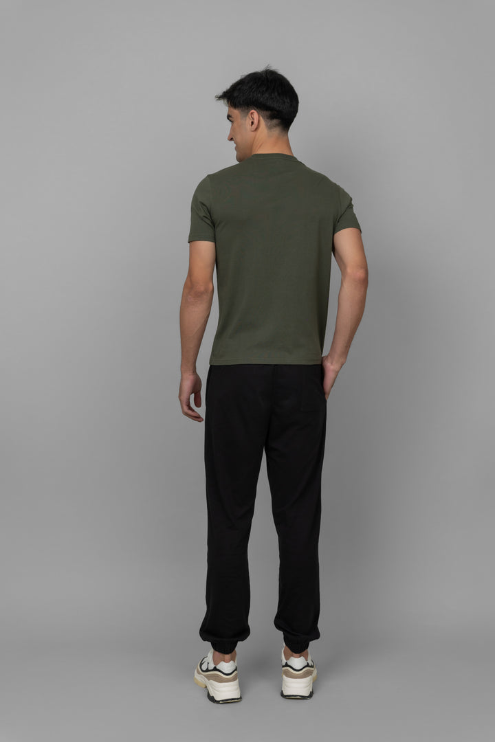 Black men's joggers worn with a casual t-shirt from the back.