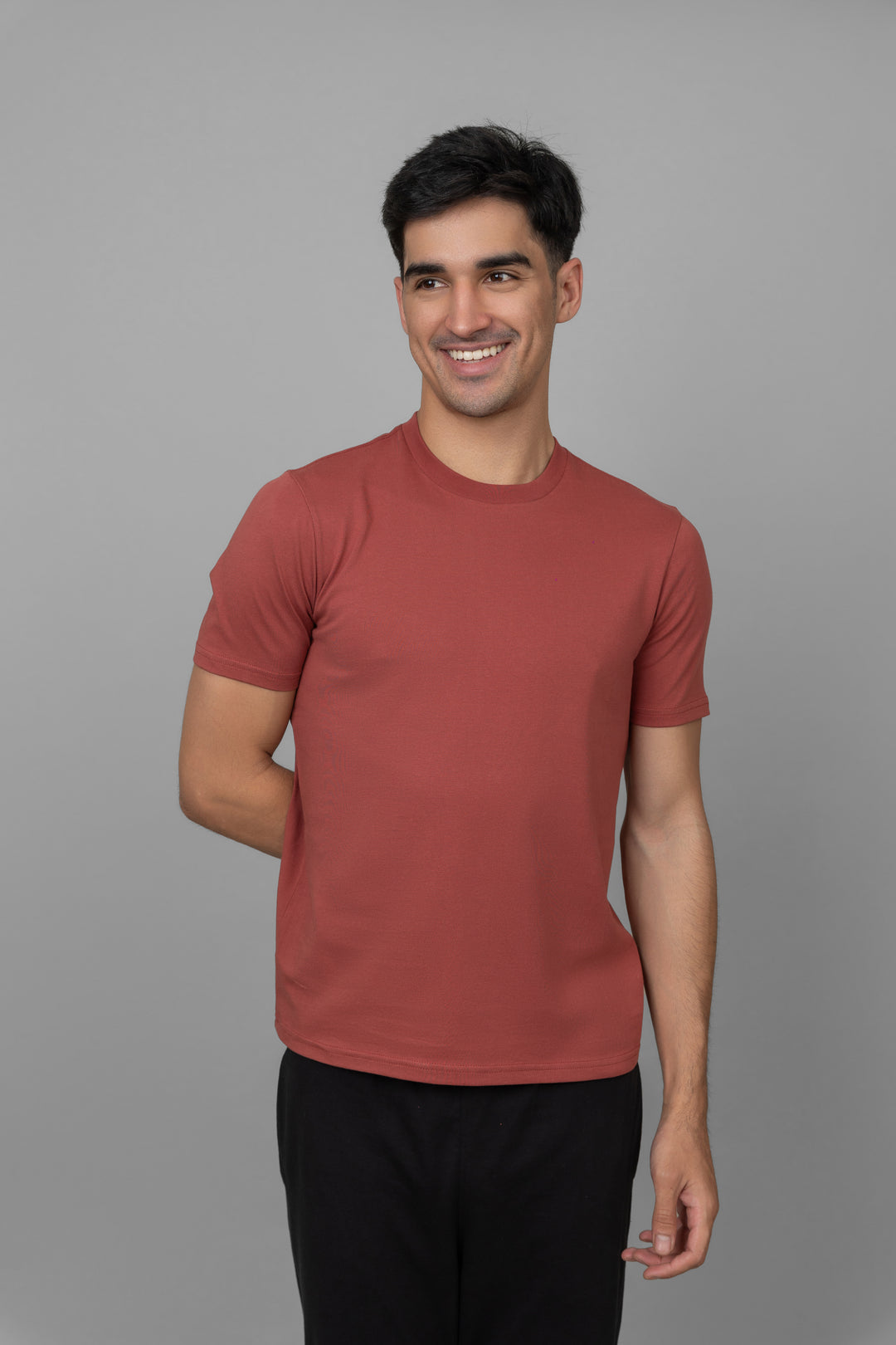 Shadow Red Men's Jogger Set model smiling in stylish athletic outfit.