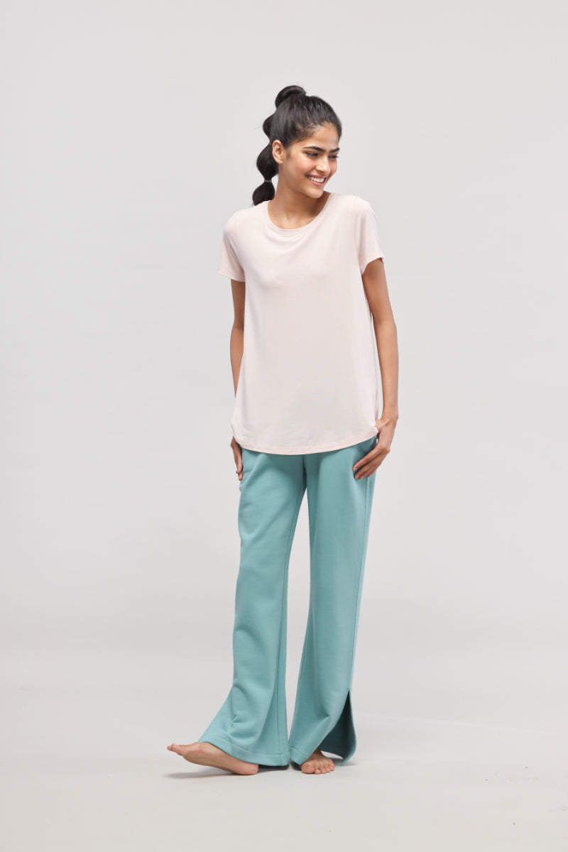 Light pink top with aqua pants travel set for women.