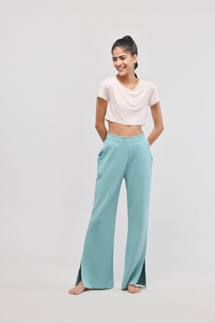 Aqua Terry Travel set featuring light pink crop top and relaxed pants.