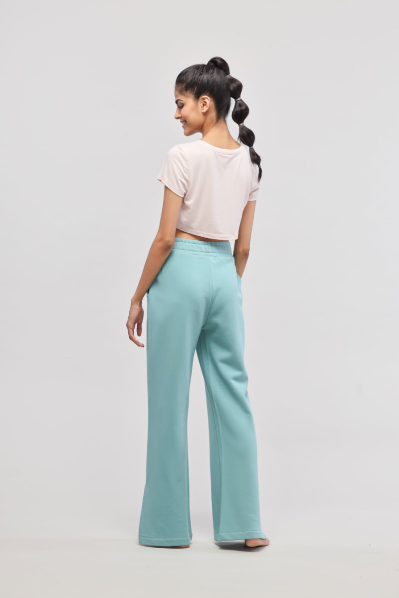 Aqua Terry travel set featuring light pink crop top and relaxed pants.