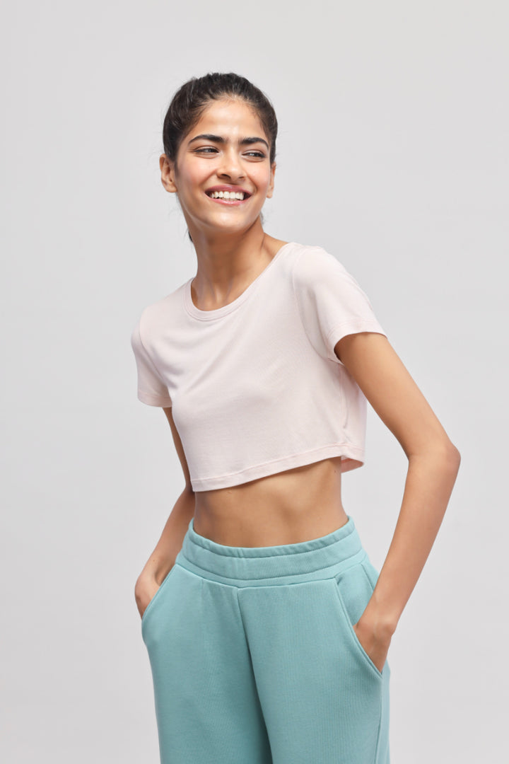 Light pink crop top with aqua pants in travel set.