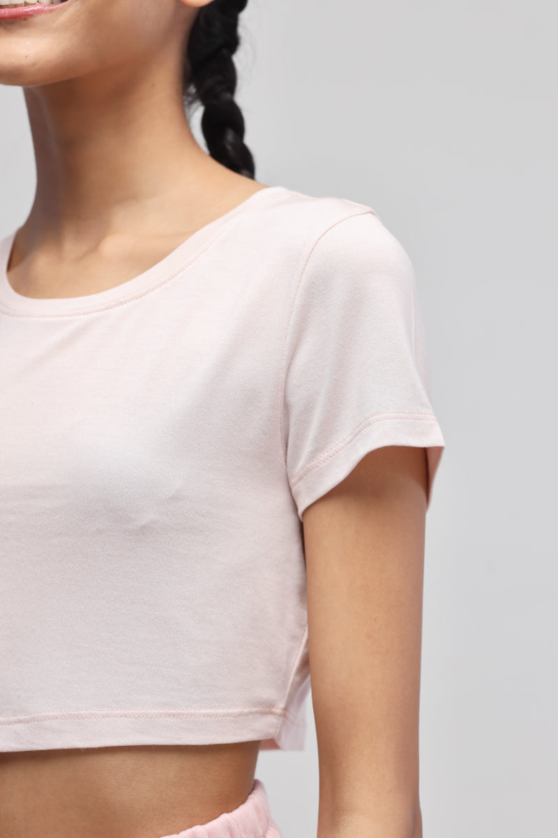 Light pink crop top showcasing stylish design and comfort.