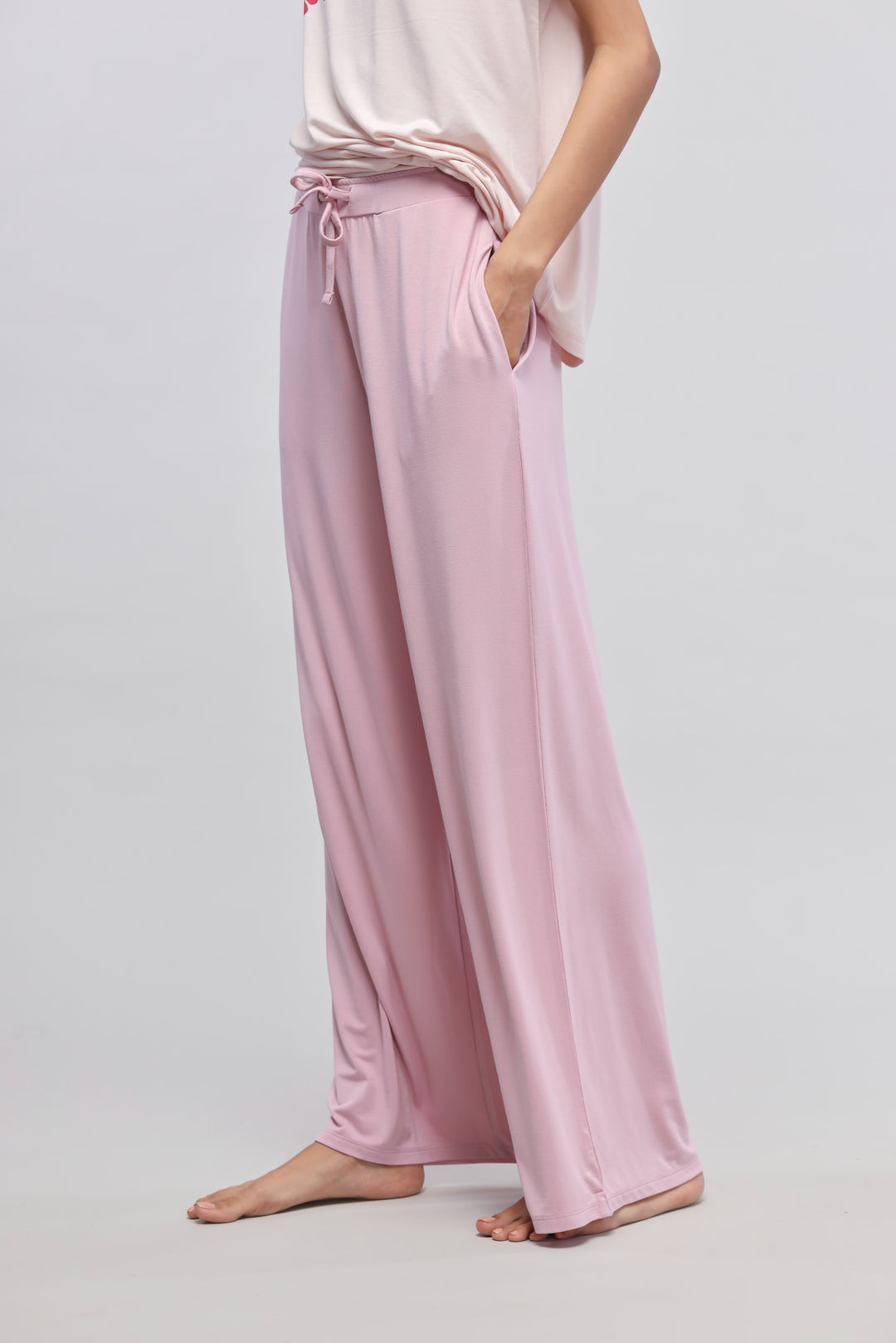 Oopsy Daisy Flared Pajama Set in pink, featuring wide-leg design and pockets.