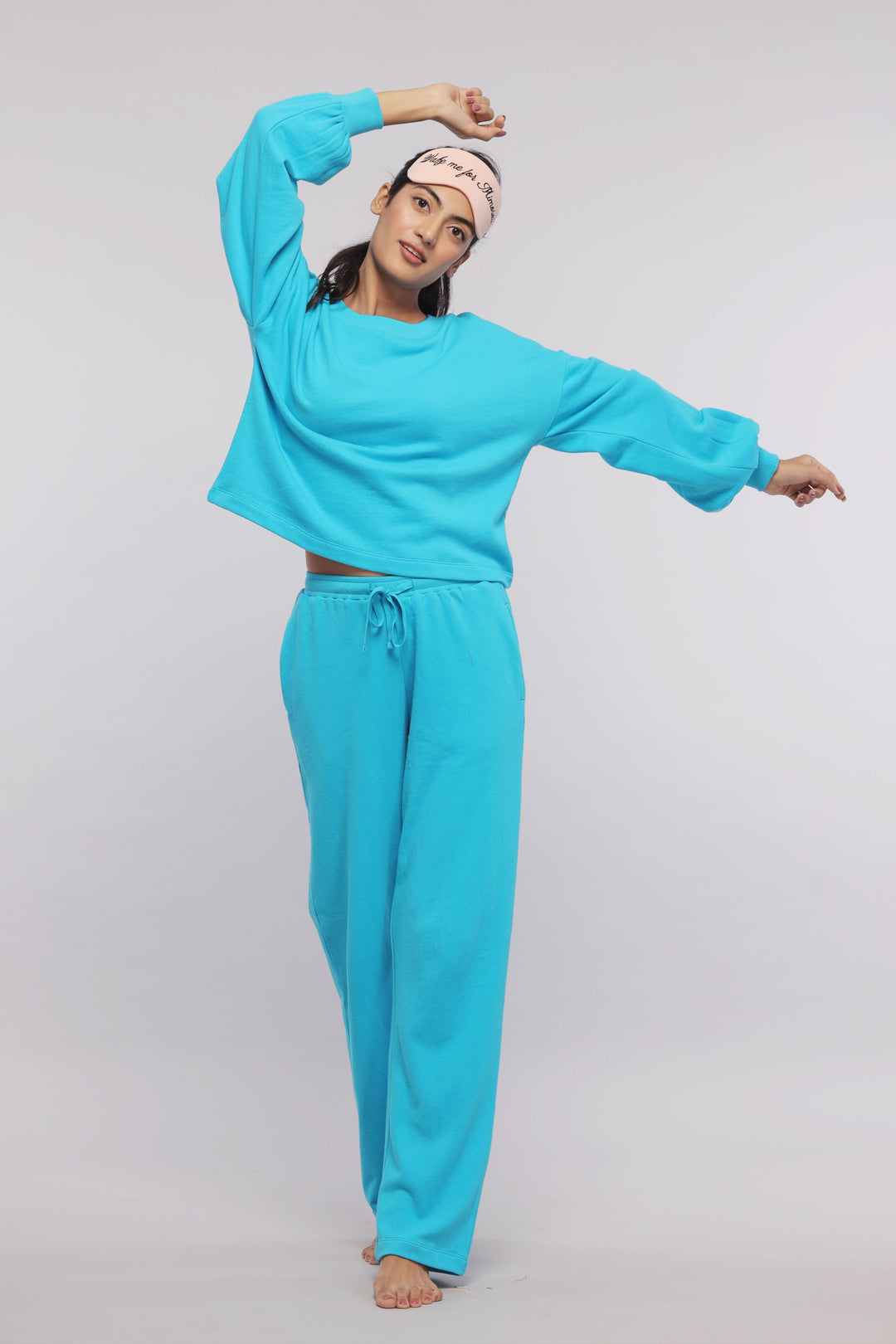 Aqua Terry Travel Set model posing in stylish turquoise outfit.