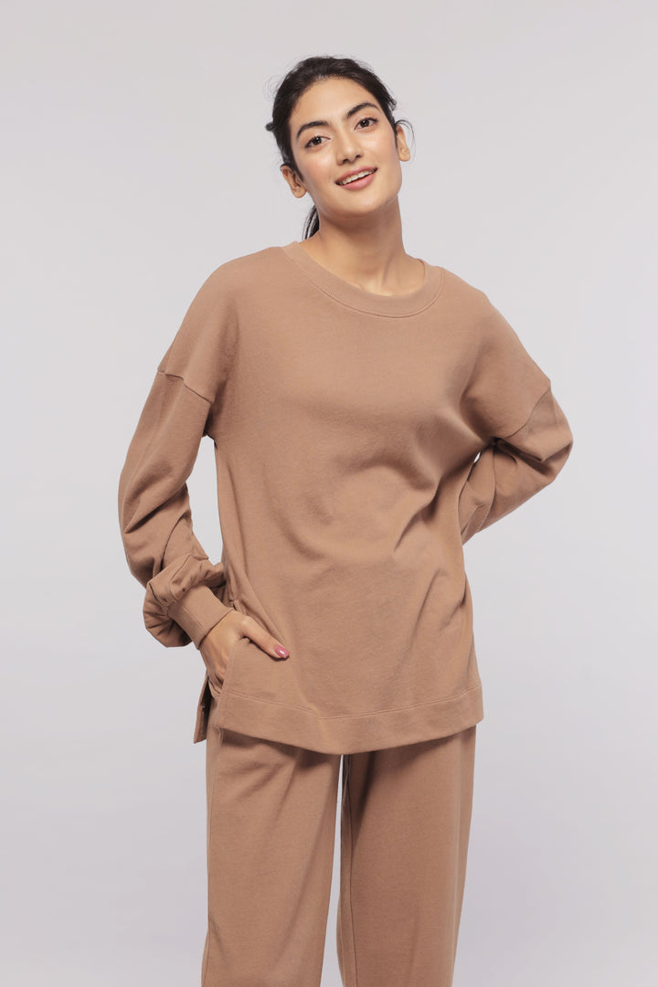 Brown terry long sweatshirt model showcasing relaxed fit and style.