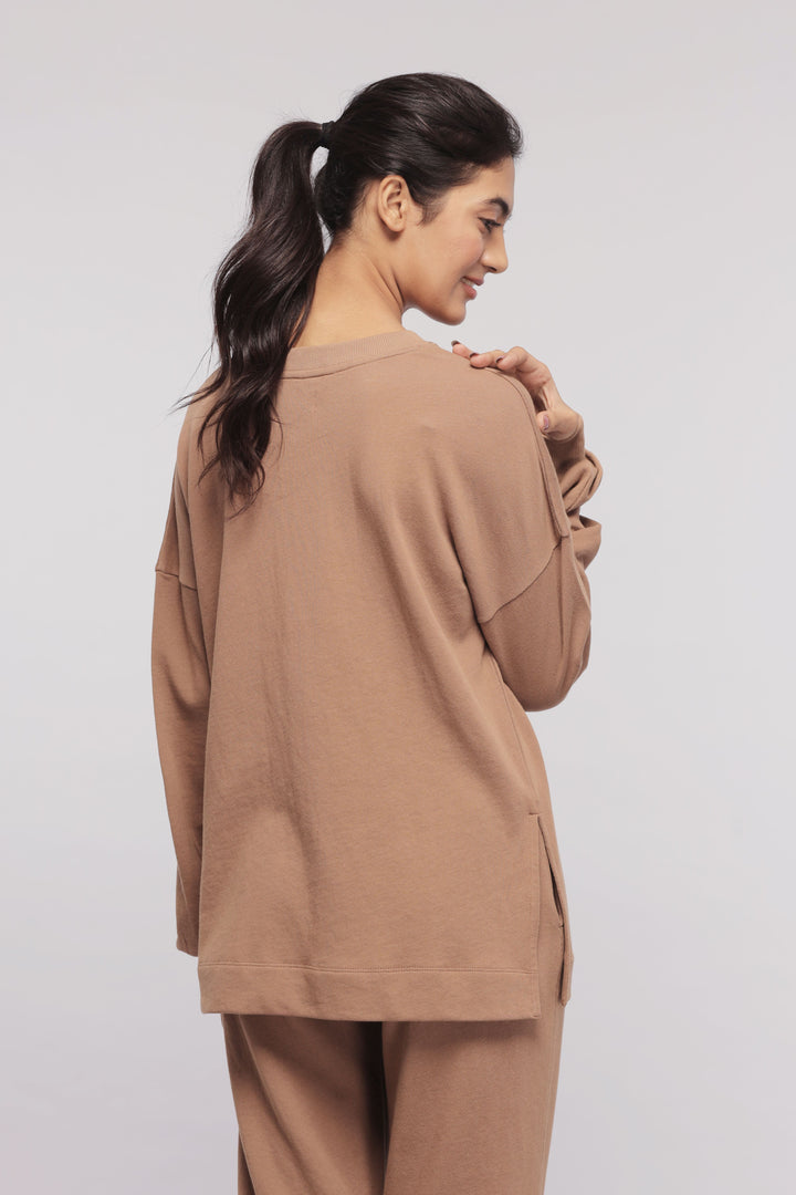 Brown Terry Long Sweatshirt on a model demonstrating the back view.