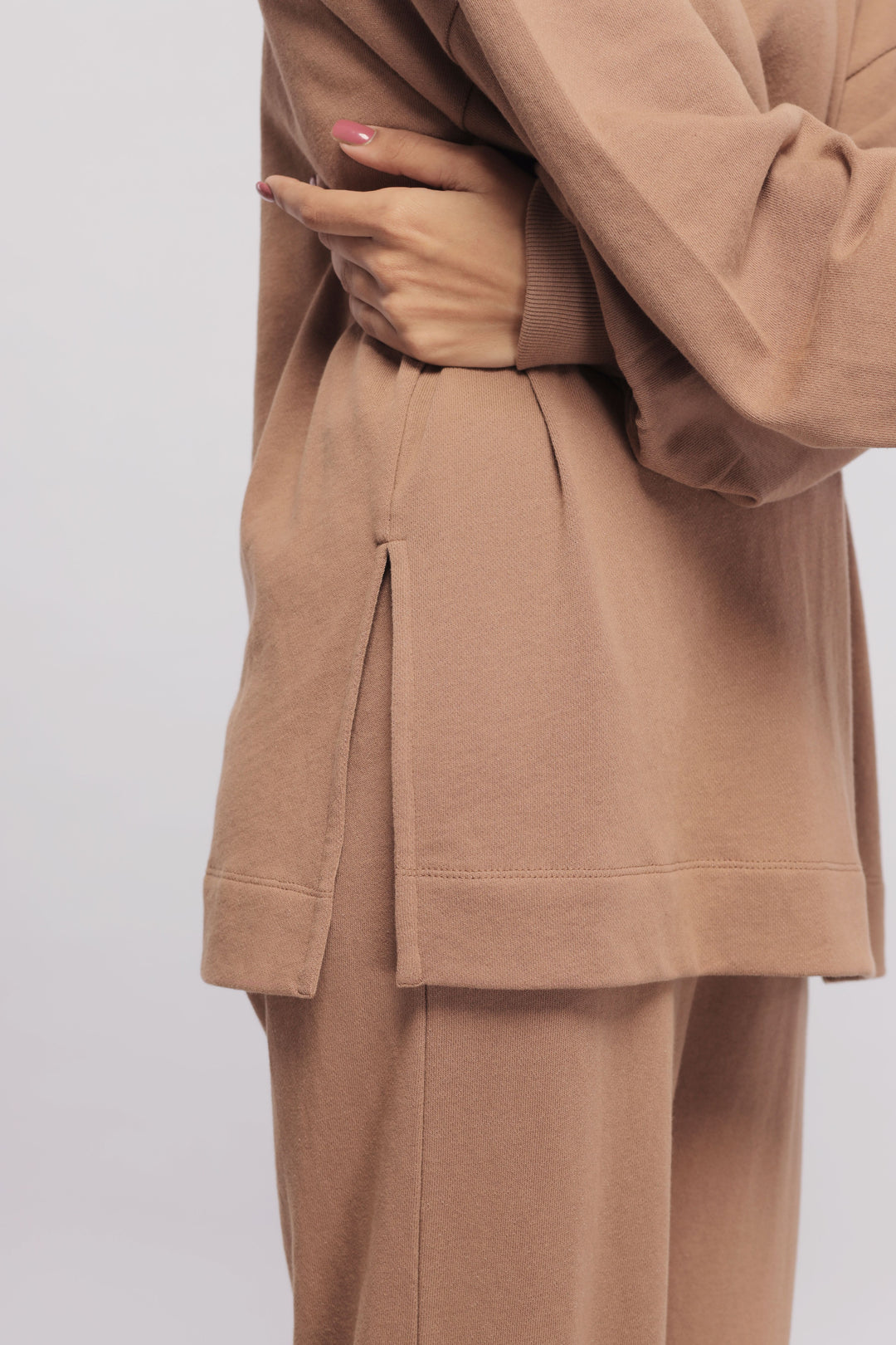 Brown terry long sweatshirt with stylish side slit detail.