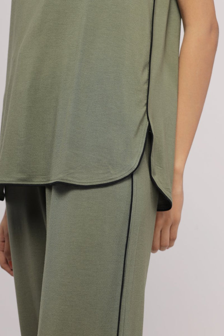 Olive green multipurpose top with stylish black accents.