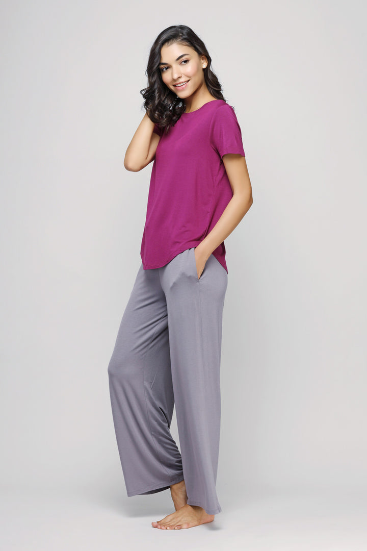 Wanderer Flared Lounge Set with purple top and gray pants.