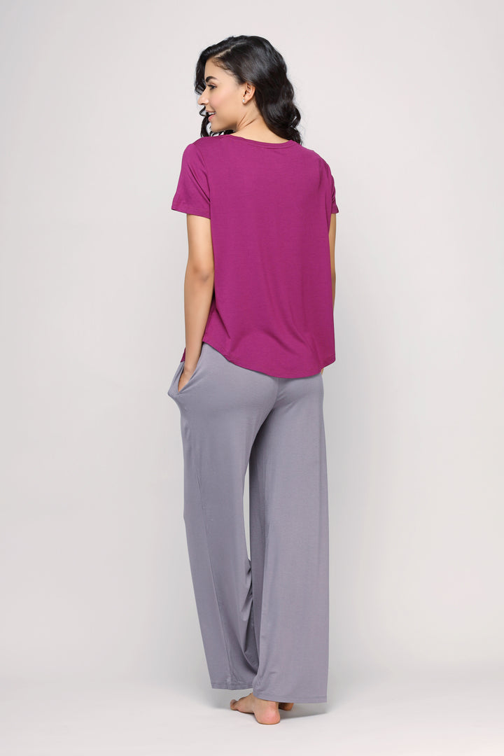 Wanderer Flared Lounge Set featuring purple top and gray pants, casual wear.