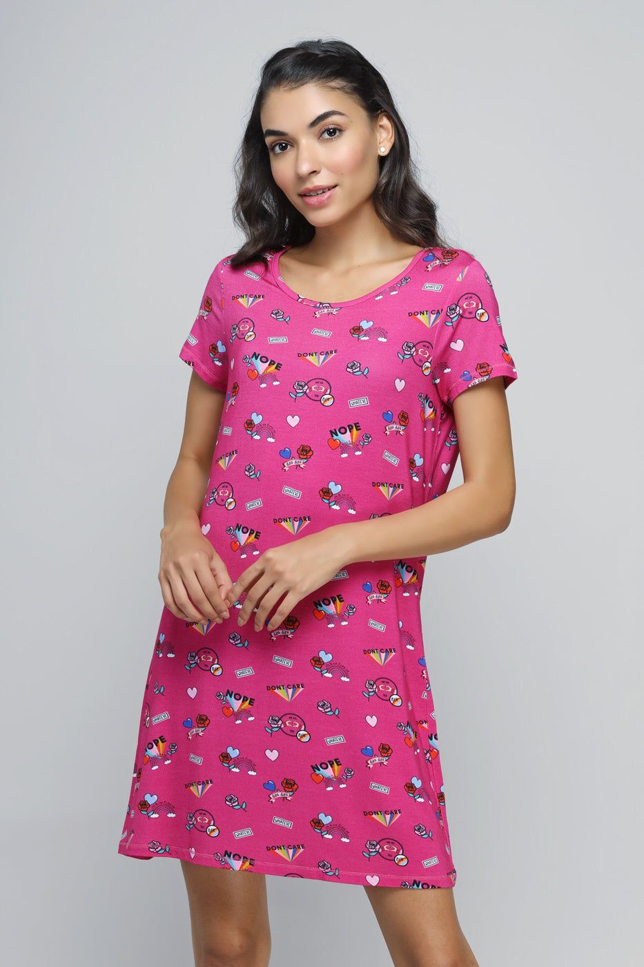 Bright pink summer short dress with playful patterns and relaxed fit.