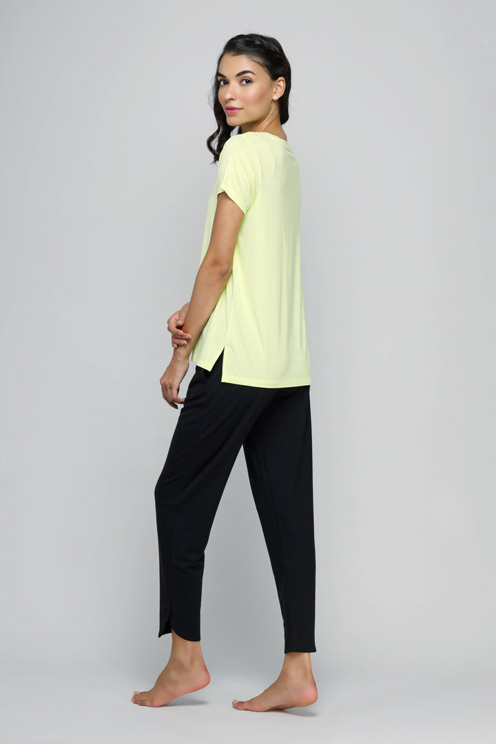 Woman in yellow jogger set, stylish activewear for fitness and leisure.