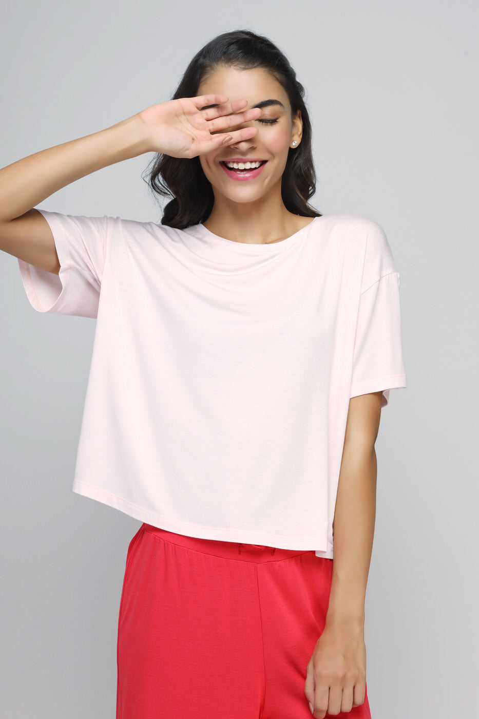 Model wearing Love Red Culottes Set featuring a pink top and red culottes.