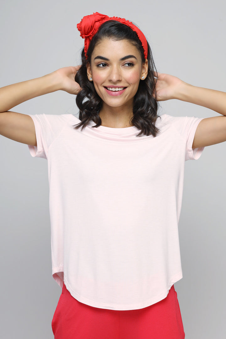 Woman wearing Love Red Flared Lounge Set with pink top and red headband.