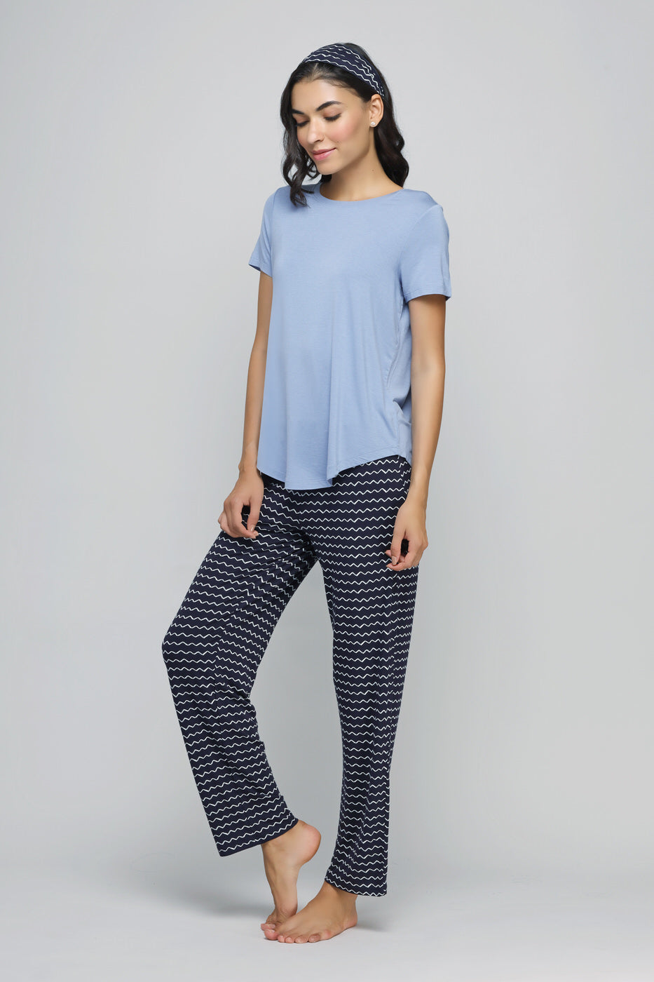 Calming blue pajama set with stylish patterned pants and matching headband.