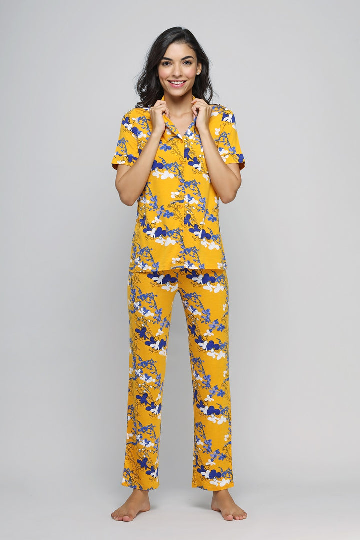 Floral Love Button Down Pajama Set in vibrant yellow with blue flowers.