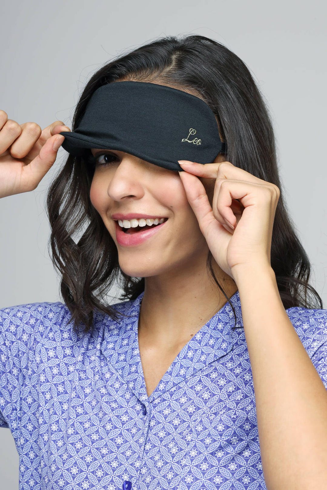 Leo Eye Mask on a smiling woman, comfortably worn for relaxation.