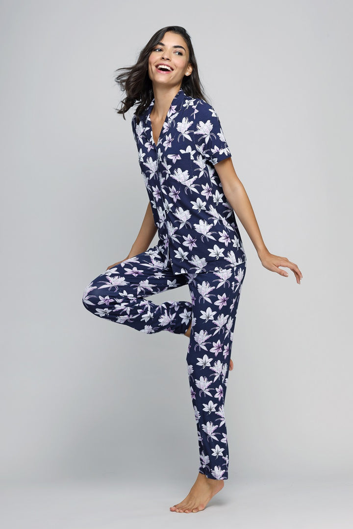 Happy Blossoms Button Down Pajama Set worn by a smiling model.