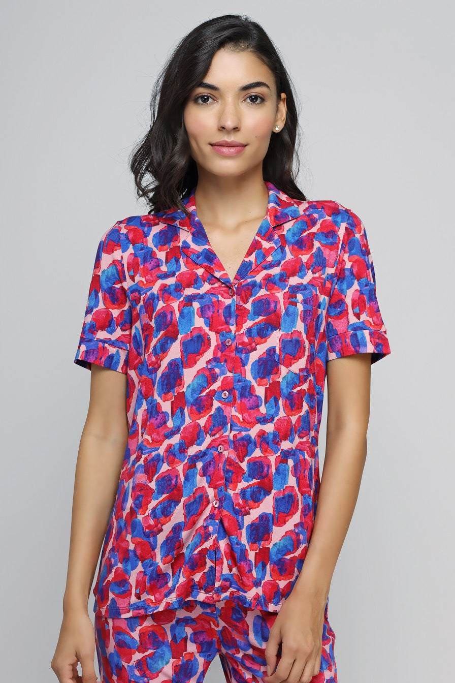 Artsy watercolor button-down pajama set in vibrant colors.